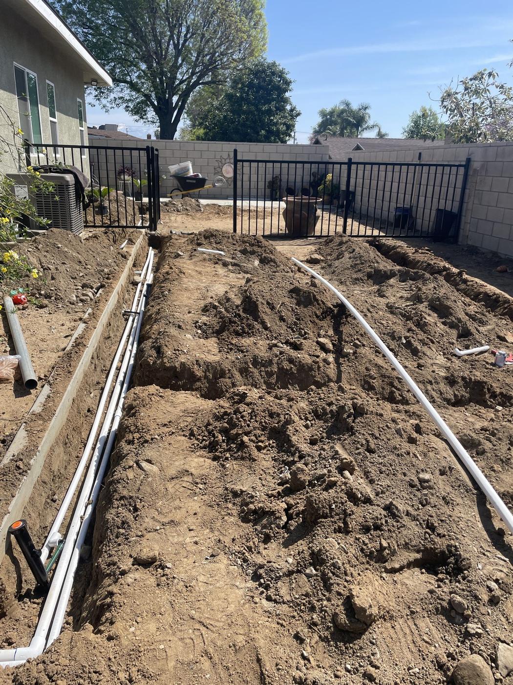 Irrigation installation with trenching and pipe layout